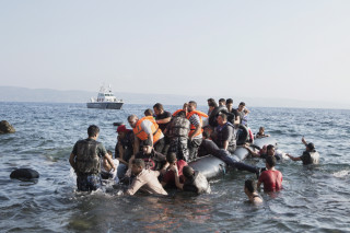 2015. Lesvos. Greece. The engine of a boat carrying around 50 Syrians fails, close to the Greek coast. When the coastguard arrives, some refugees jump into the water out of fear and try to swim to the shore. Eventually, the tide carries the boat in, with the remaning Syrians.