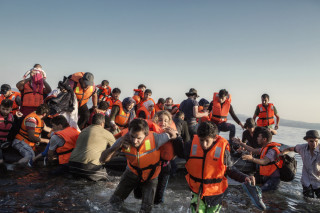 2015. Lesvos. Greece. A group of Syrians disembark on the north of the Greek island of Lesvos.
